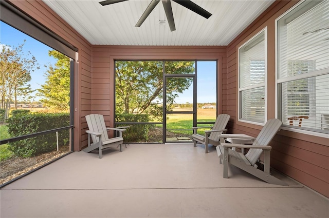 sunroom / solarium with ceiling fan