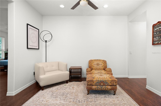 sitting room featuring ceiling fan and hardwood / wood-style flooring