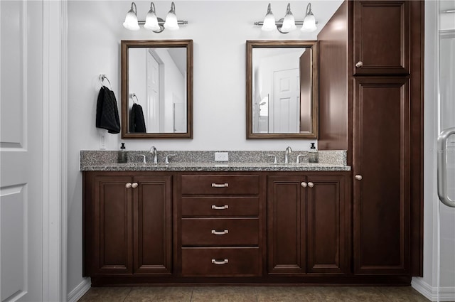 bathroom featuring tile patterned floors and vanity