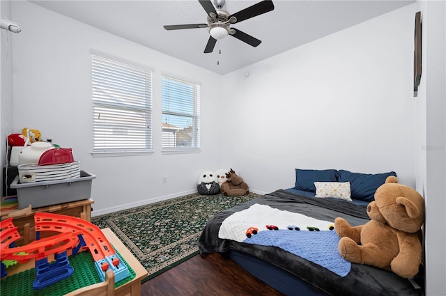 bedroom featuring ceiling fan and hardwood / wood-style floors