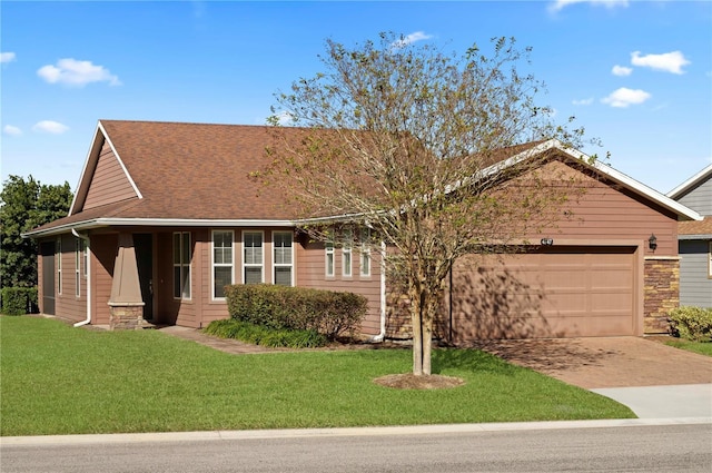 view of front facade featuring a garage and a front lawn