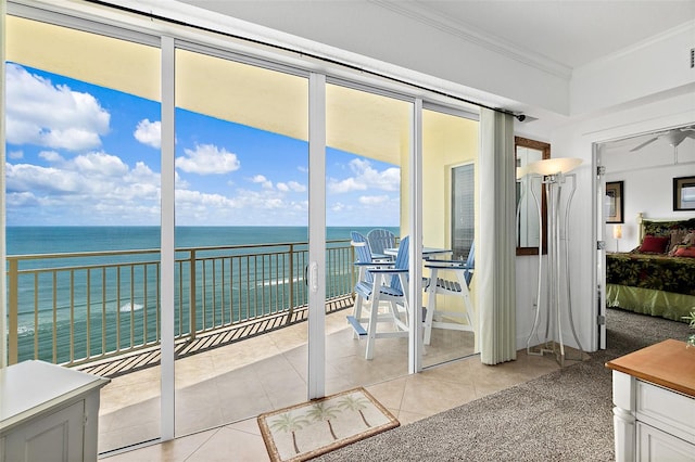 unfurnished sunroom with ceiling fan and a water view