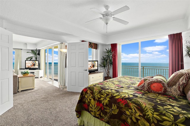 bedroom with access to exterior, multiple windows, light carpet, and ceiling fan