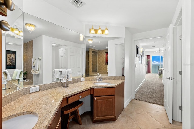 bathroom featuring an enclosed shower, vanity, tile patterned floors, and ceiling fan