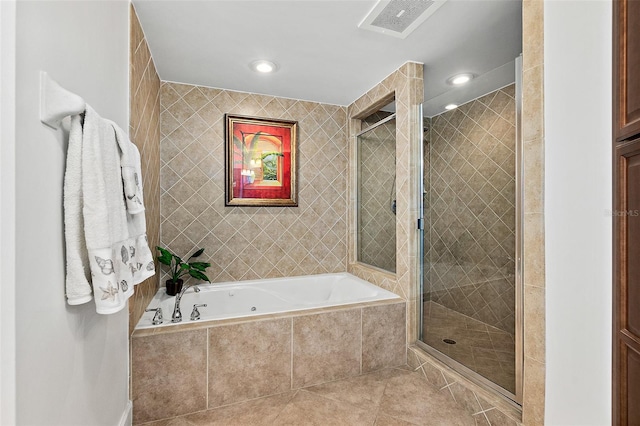 bathroom with tile patterned floors and separate shower and tub