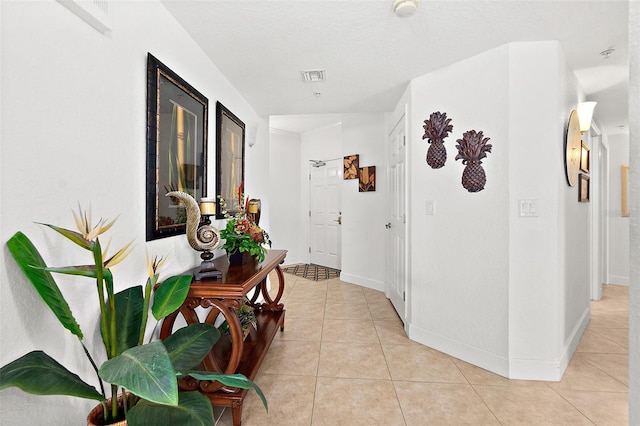 corridor featuring light tile patterned flooring