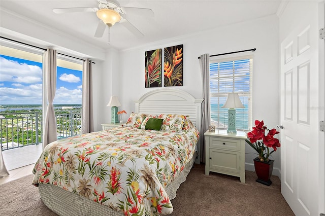 carpeted bedroom featuring multiple windows, access to outside, ornamental molding, and ceiling fan