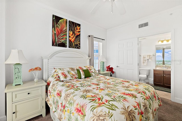 carpeted bedroom with multiple windows, ceiling fan, and crown molding