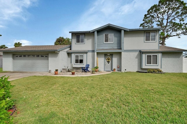 front facade featuring a garage and a front lawn