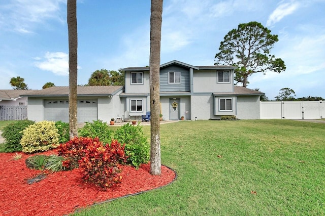 view of front of house featuring a garage and a front yard