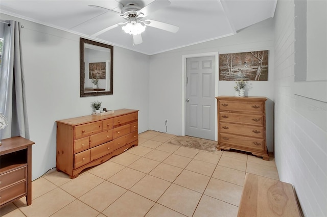 bedroom with crown molding, ceiling fan, and light tile patterned floors