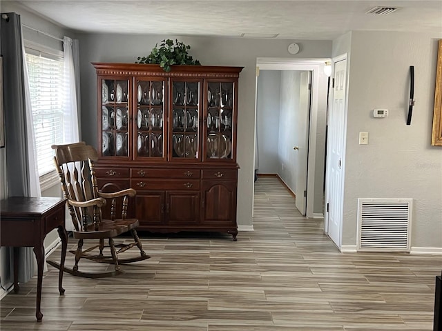 sitting room with light hardwood / wood-style flooring