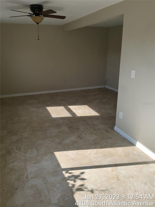 unfurnished room with ceiling fan