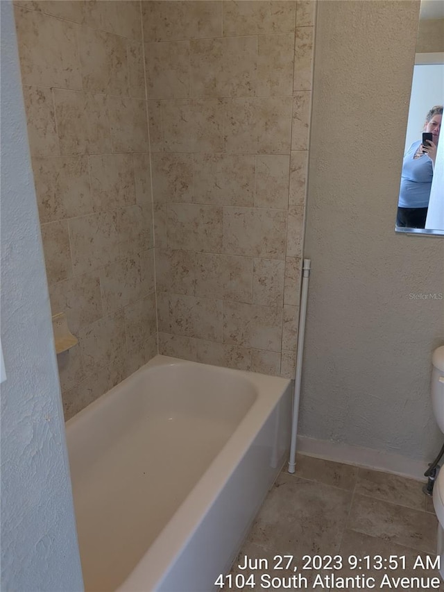 bathroom with  shower combination and toilet