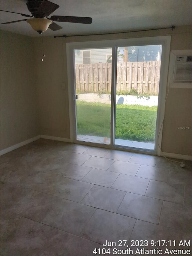 unfurnished room featuring tile patterned floors, an AC wall unit, plenty of natural light, and ceiling fan