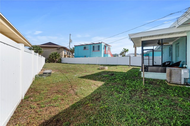 view of yard featuring central air condition unit