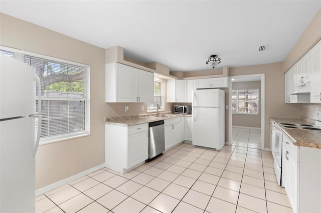 kitchen with white cabinetry and appliances with stainless steel finishes