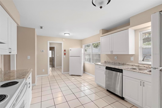 kitchen with white cabinetry, sink, white appliances, and a healthy amount of sunlight