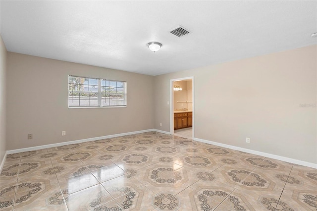 unfurnished room with tile patterned flooring