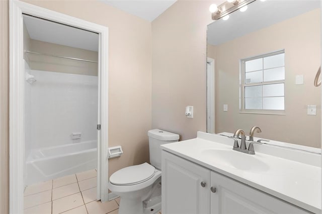 full bathroom featuring tile patterned floors, vanity, toilet, and washtub / shower combination