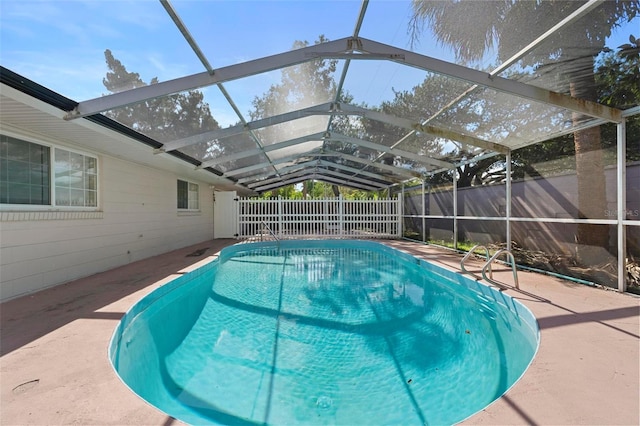 view of pool featuring a patio and a lanai