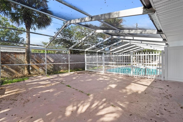 view of pool with a patio and a lanai