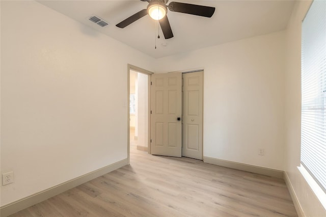 spare room with ceiling fan and light hardwood / wood-style flooring