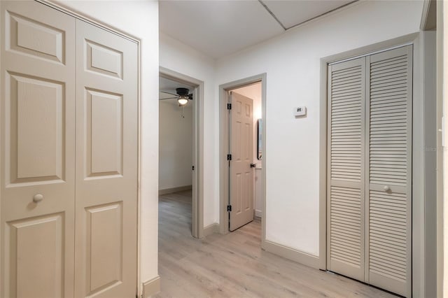 hallway with light wood-type flooring