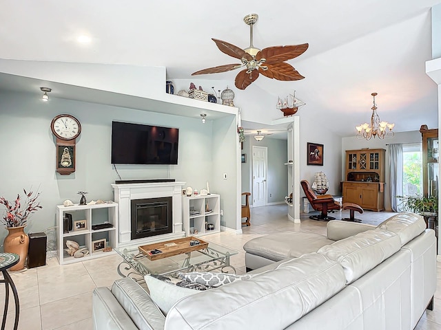 living room with light tile patterned floors, ceiling fan with notable chandelier, and lofted ceiling