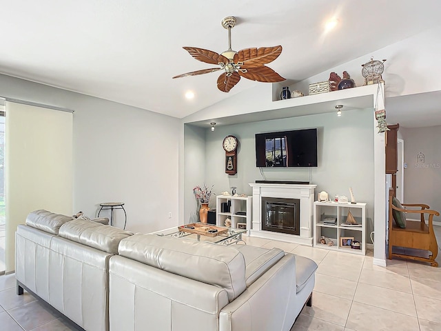 tiled living room featuring ceiling fan and lofted ceiling