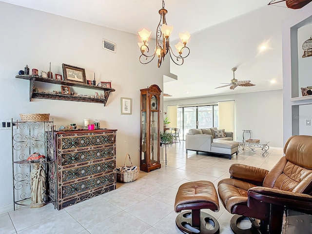 living room featuring ceiling fan with notable chandelier and light tile patterned floors