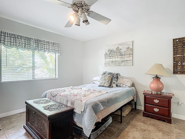 bedroom with light tile patterned floors and ceiling fan