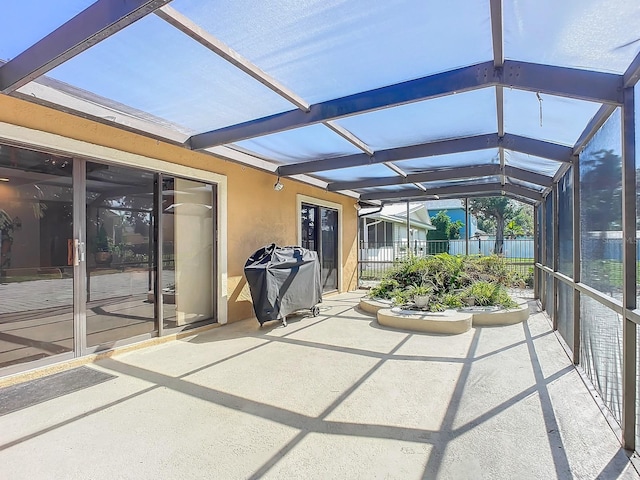 unfurnished sunroom with lofted ceiling