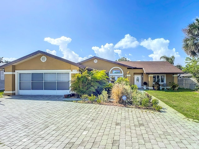 single story home featuring a front yard and a garage