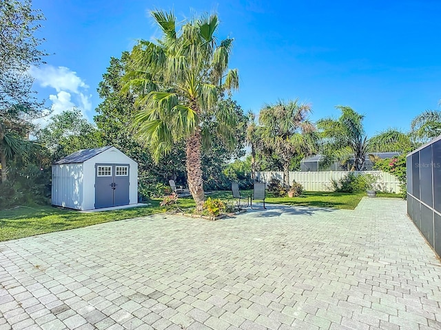 exterior space with a patio area and a storage shed