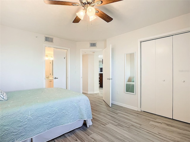 bedroom with ceiling fan, a closet, and light wood-type flooring