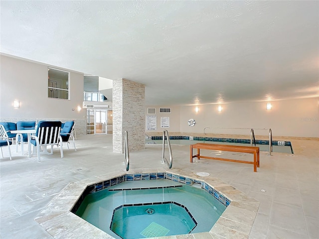 view of swimming pool featuring an indoor in ground hot tub