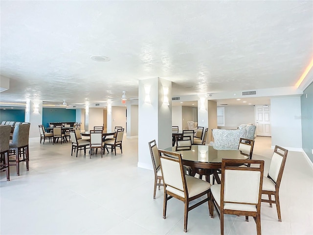 dining space with a textured ceiling