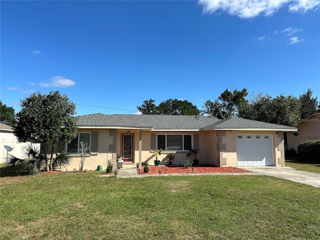 ranch-style home with a garage and a front lawn