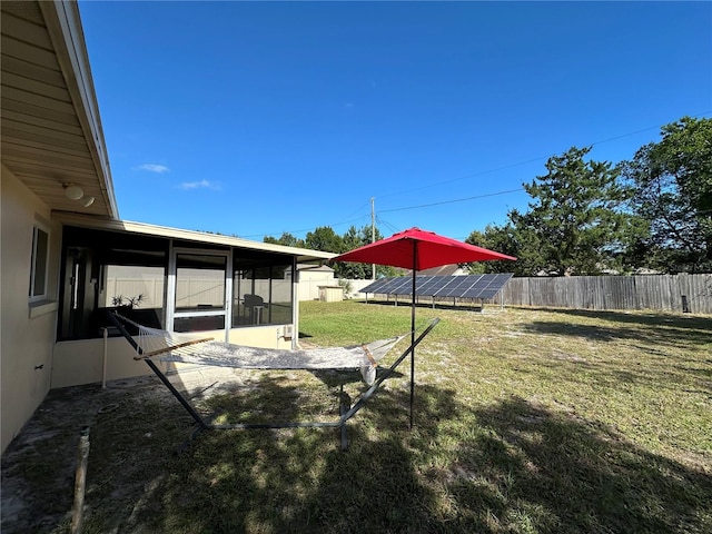 view of yard featuring a sunroom