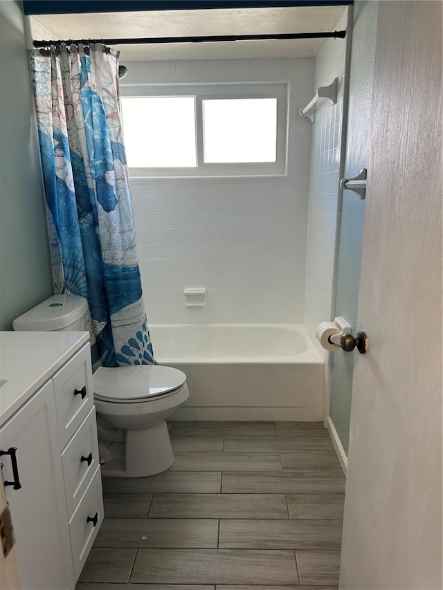 full bathroom featuring vanity, toilet, and shower / bath combo with shower curtain