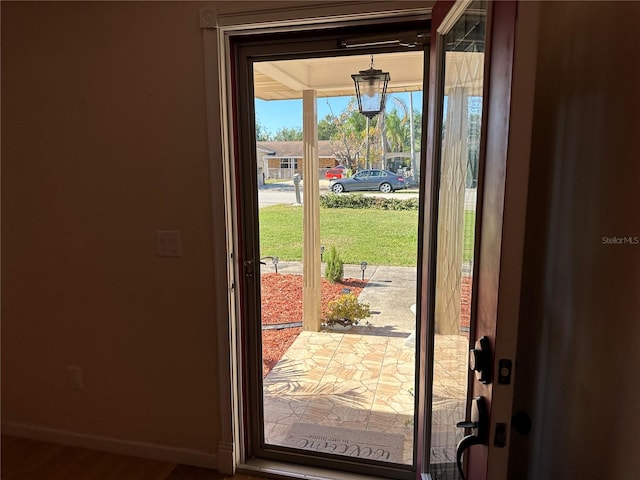 doorway with wood-type flooring