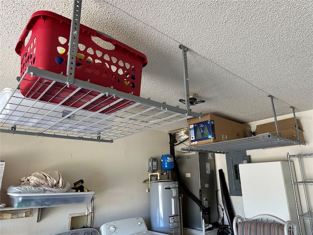 details featuring white refrigerator, washer / dryer, and gas water heater