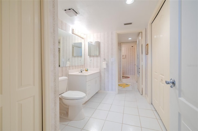 bathroom with tile patterned floors, vanity, and toilet