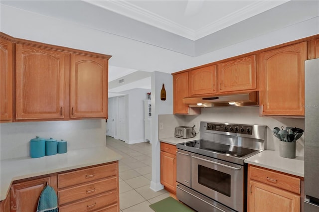 kitchen featuring appliances with stainless steel finishes, light tile patterned floors, and ornamental molding