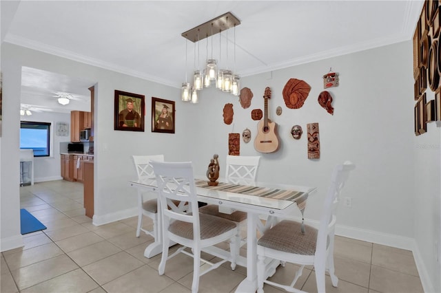 tiled dining area with ceiling fan with notable chandelier and ornamental molding