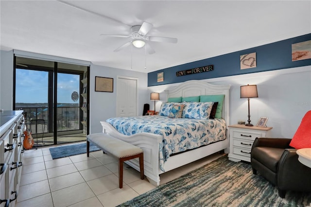 bedroom with tile patterned floors, ceiling fan, access to outside, and a closet