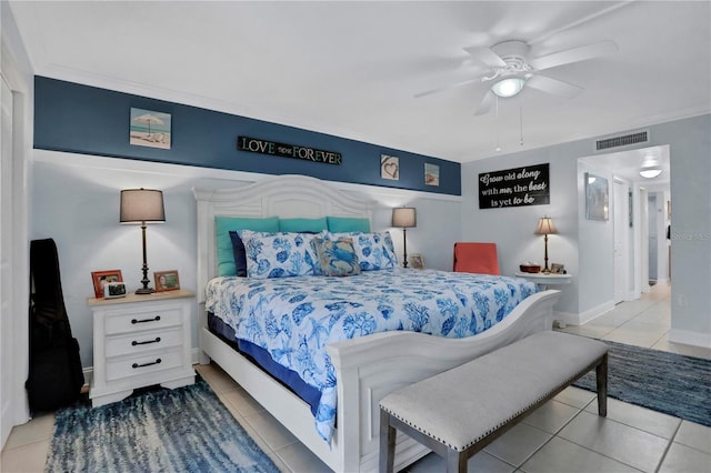 bedroom featuring ceiling fan, light tile patterned flooring, and ornamental molding