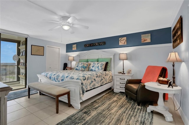 tiled bedroom with a closet and ceiling fan