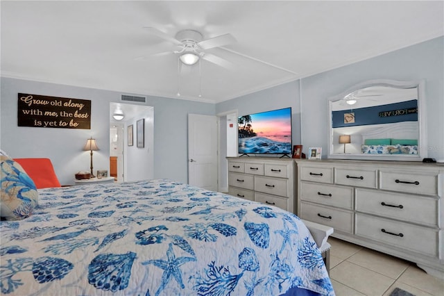 bedroom featuring ceiling fan, light tile patterned flooring, and ornamental molding